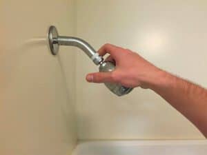 fixing shower head loose on wall